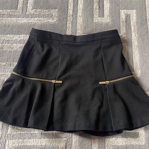 Michael Kors size 4 black skirt with gold zipper details. Worn once